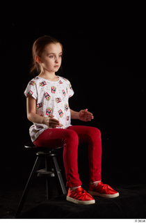 Lilly  1 dressed red leggings red shoes sitting t…